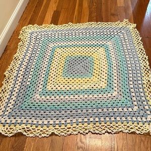 Hand knitted blanket and small baby “shoes”